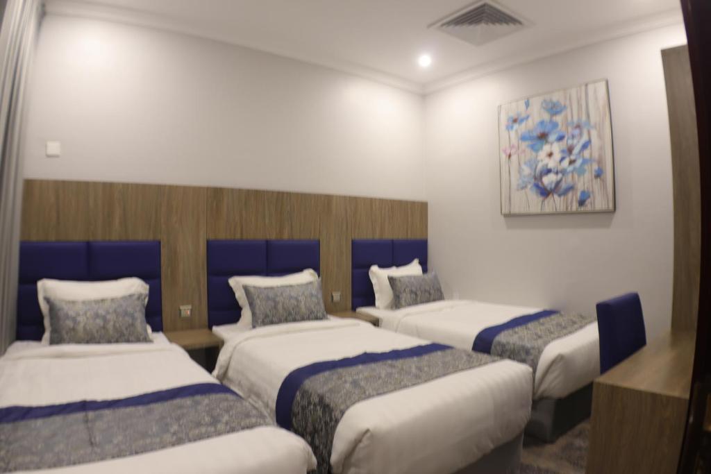 Postel nebo postele na pokoji v ubytování Swat Olaya Hotel Apartments