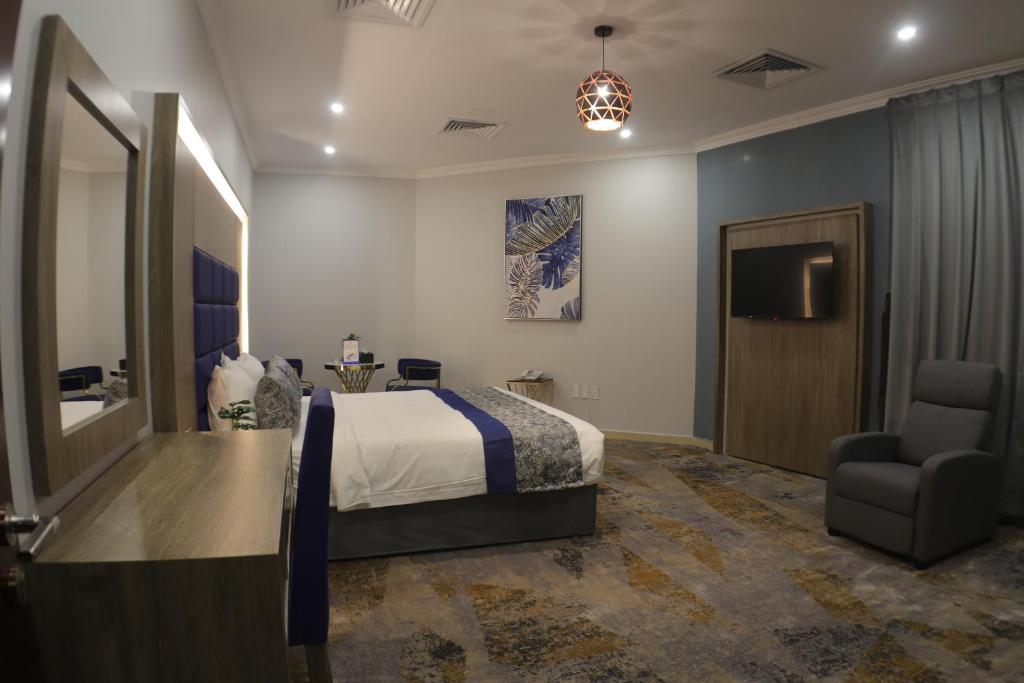 Postel nebo postele na pokoji v ubytování Swat Olaya Hotel Apartments