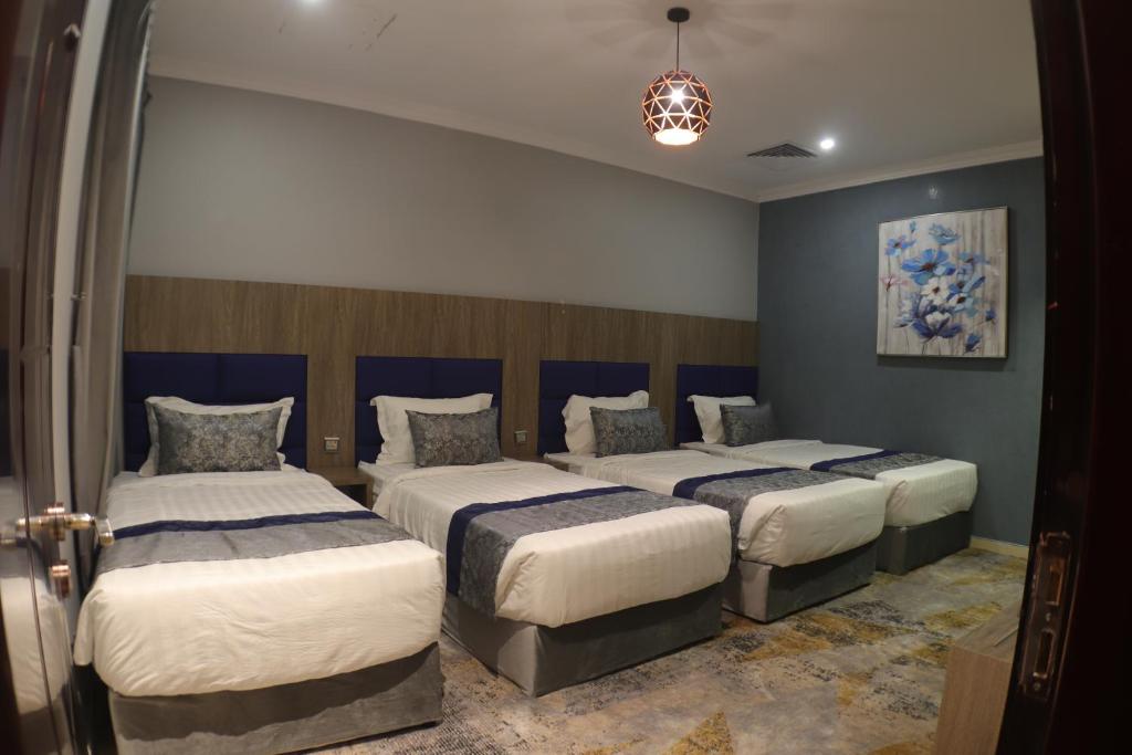Postel nebo postele na pokoji v ubytování Swat Olaya Hotel Apartments