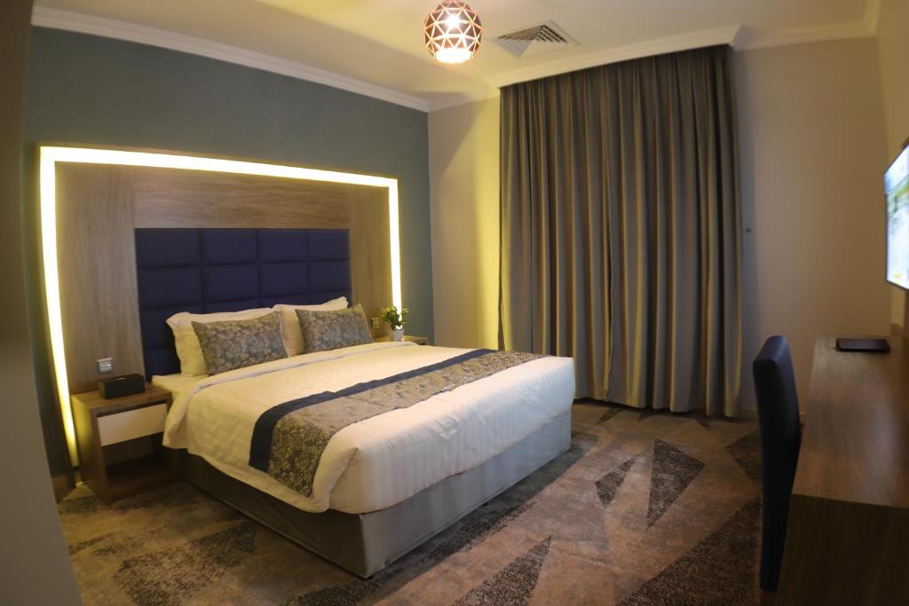 Postel nebo postele na pokoji v ubytování Swat Olaya Hotel Apartments