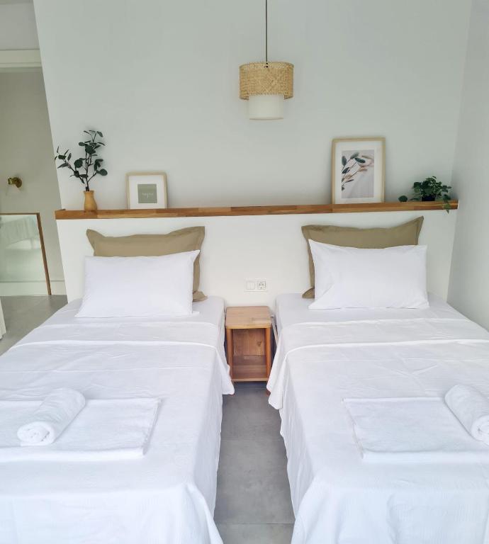 A bed or beds in a room at Ozilvillas