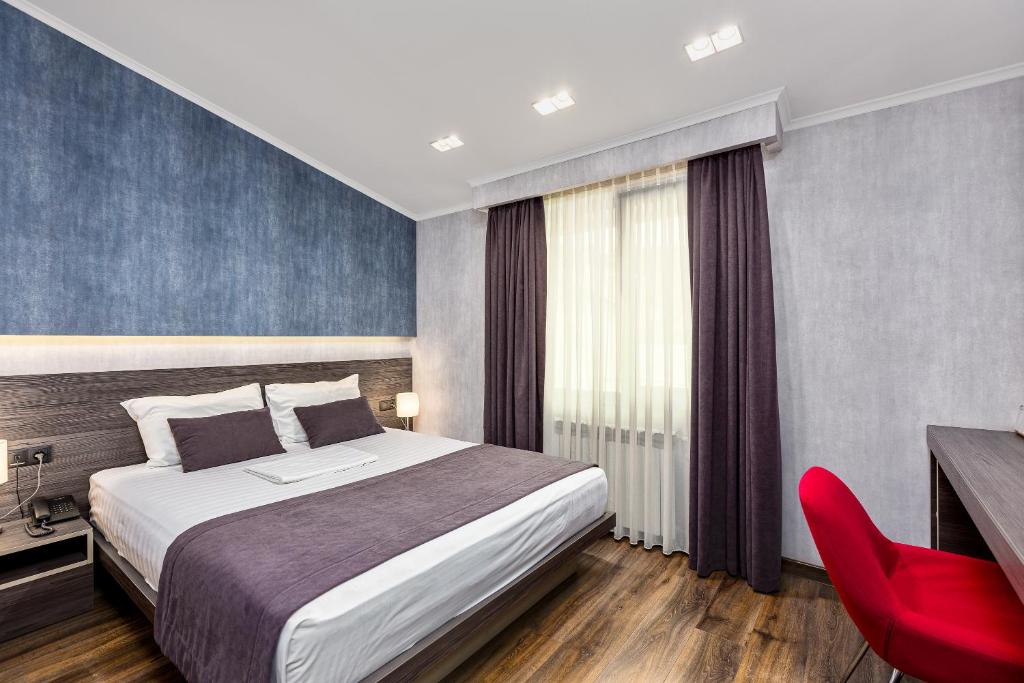 Postel nebo postele na pokoji v ubytování Kope Palace