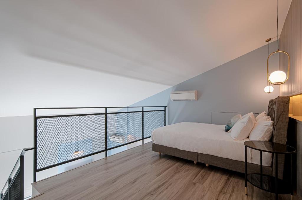 Postel nebo postele na pokoji v ubytování 森行旅 Mori Hotel -台南安平老街