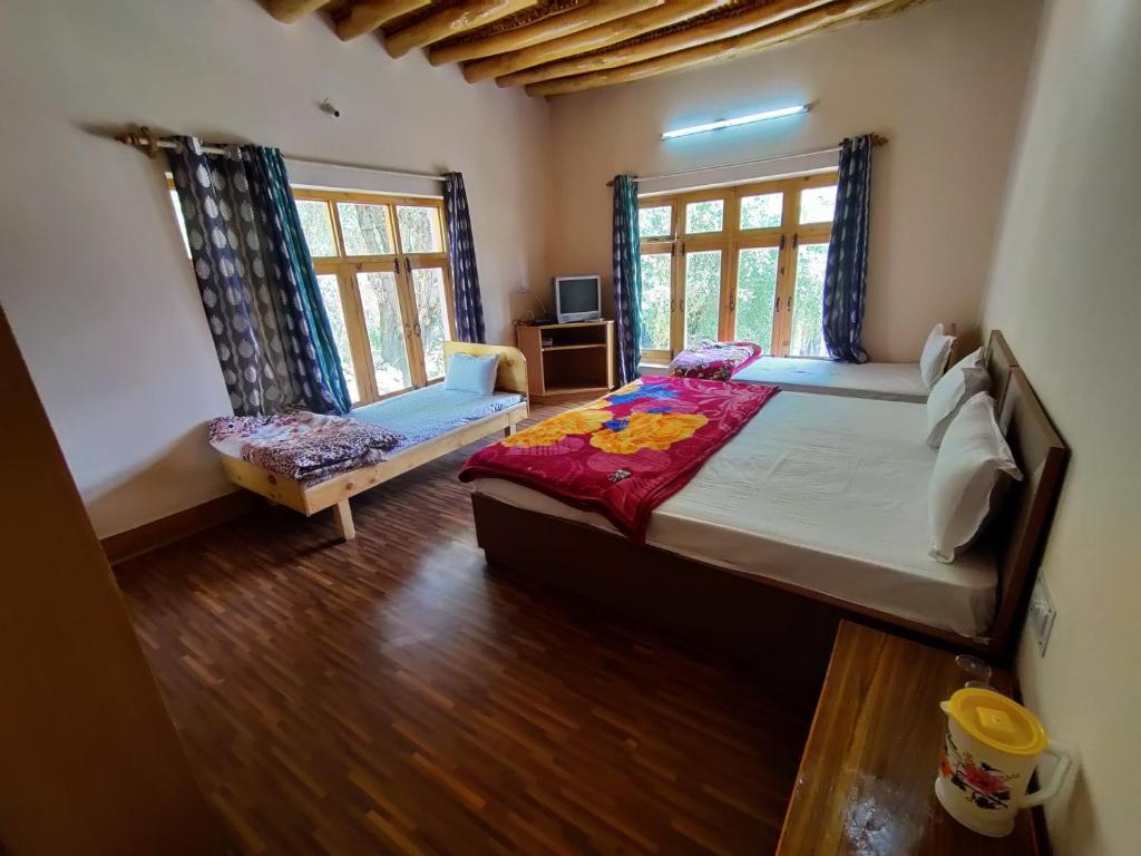 Postel nebo postele na pokoji v ubytování Nilza Guest House