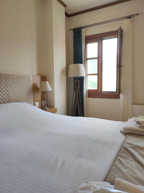 Postel nebo postele na pokoji v ubytování NUCA GUESTHOUSE