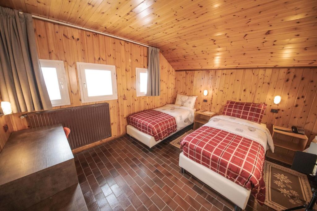 Postel nebo postele na pokoji v ubytování Albergo Quarto Pirovano