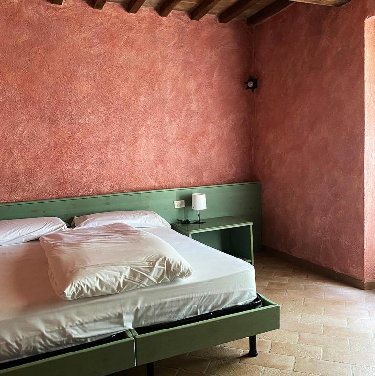 Posteľ alebo postele v izbe v ubytovaní Agriturismo Monte Gusciani