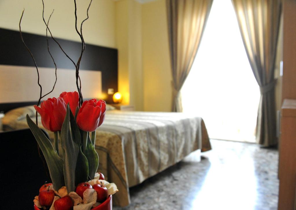 A bed or beds in a room at Hotel Gabbiano