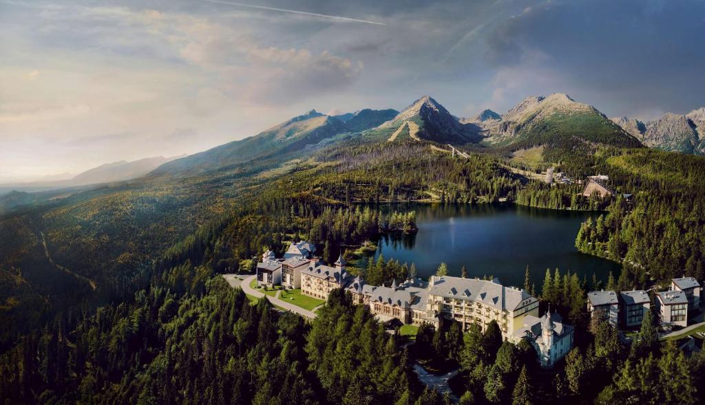 an aerial view of a resort in the middle of a lake at Grand Hotel Kempinski High Tatras in Vysoke Tatry - Strbske Pleso