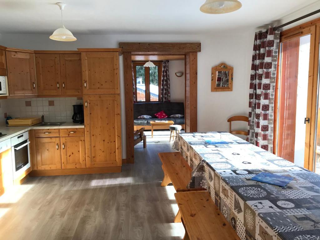 a kitchen with a table and a dining room at Montana 3 in Pralognan-la-Vanoise