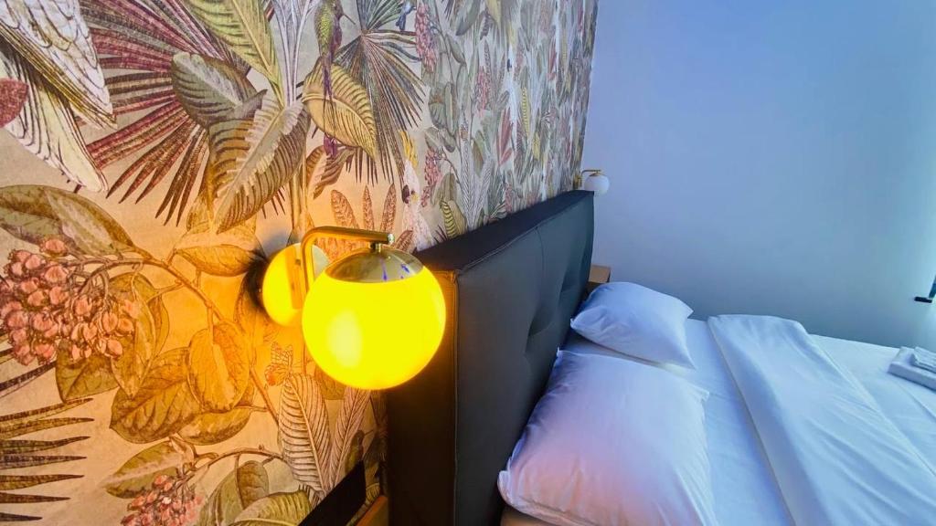 Postel nebo postele na pokoji v ubytování BED Cauchy