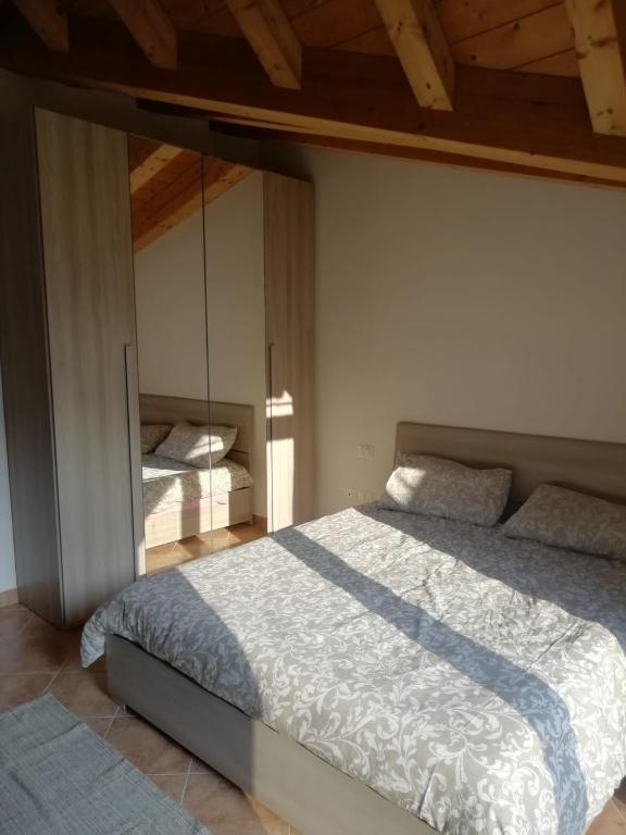 Postel nebo postele na pokoji v ubytování Residence TANA - via Pasubio