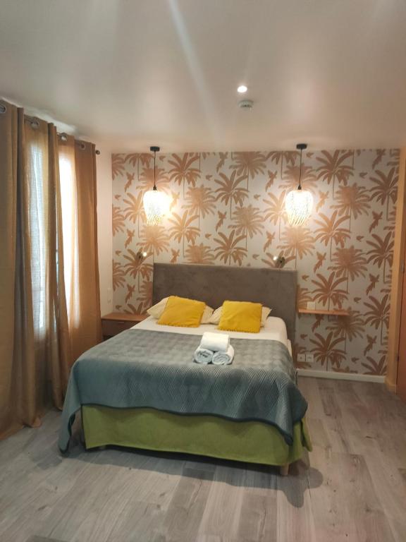 Postel nebo postele na pokoji v ubytování Hotel du Levant