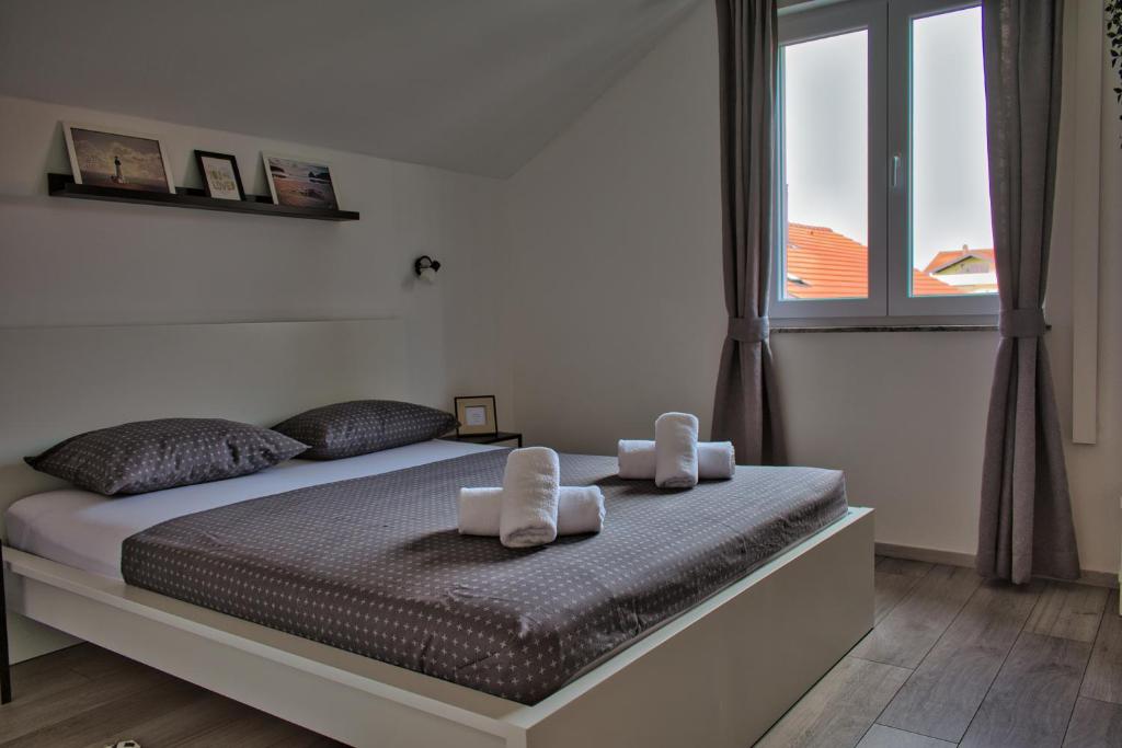 Posteľ alebo postele v izbe v ubytovaní Apartments and Rooms B&B