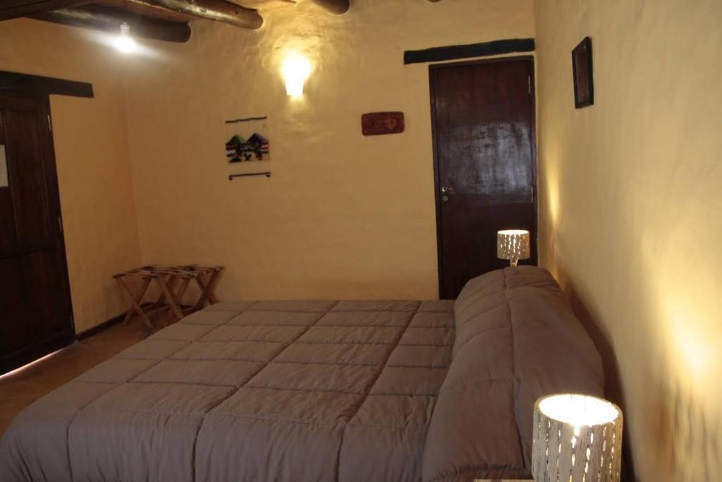 Postel nebo postele na pokoji v ubytování Hosteria La Estacion