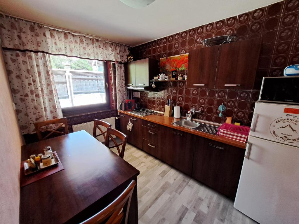 Kuchyň nebo kuchyňský kout v ubytování Villa in High Tatras Residence VDV