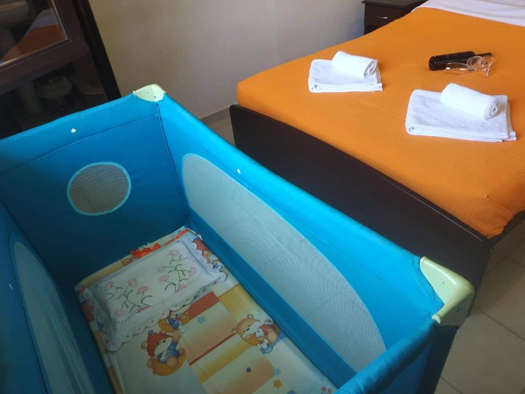 Postel nebo postele na pokoji v ubytování GIOTAS APARTMENTS - STUDIOS