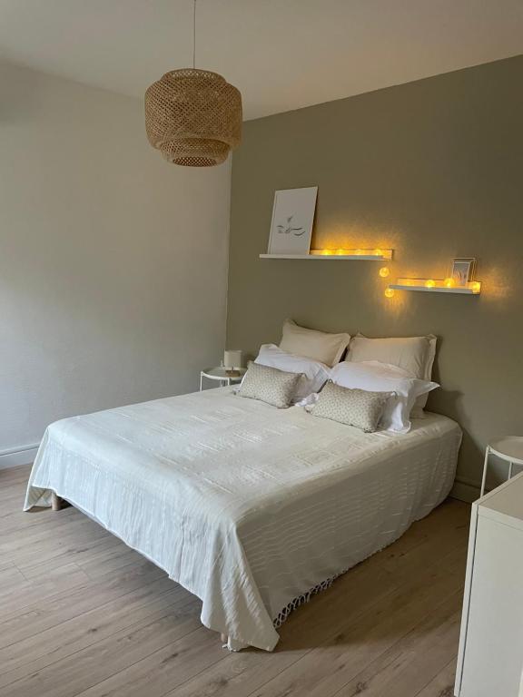 Posteľ alebo postele v izbe v ubytovaní Le Marceau - Maison climatisée avec jardin