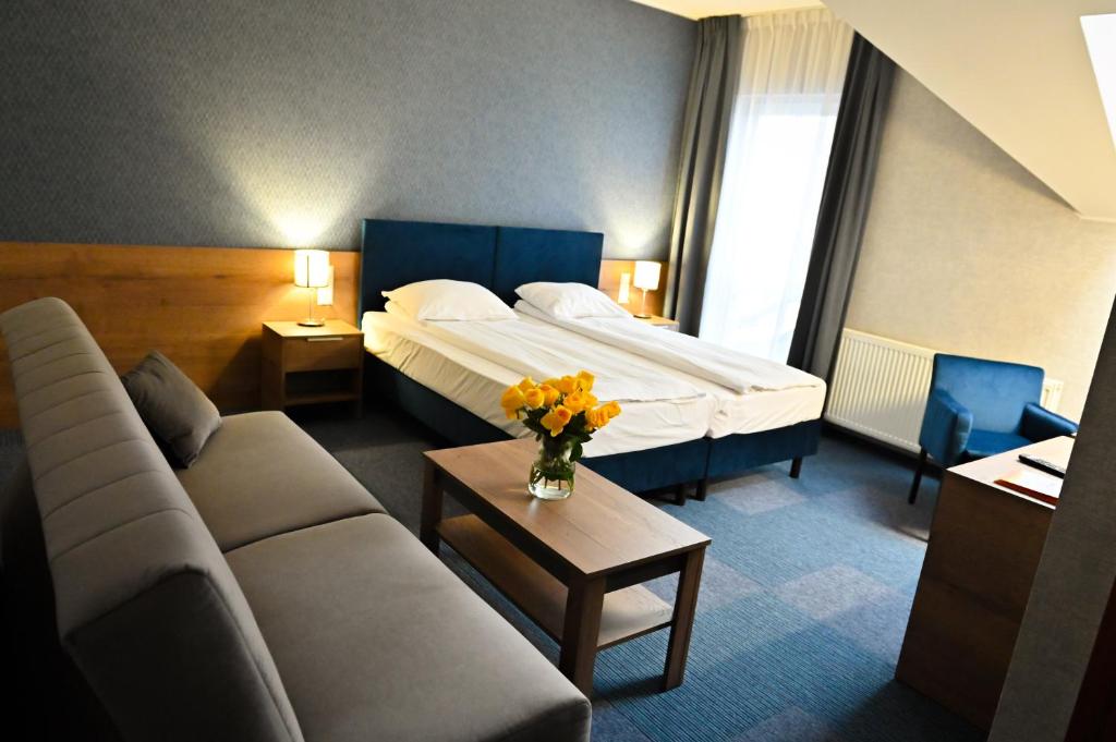 Posteľ alebo postele v izbe v ubytovaní Hotel Rad