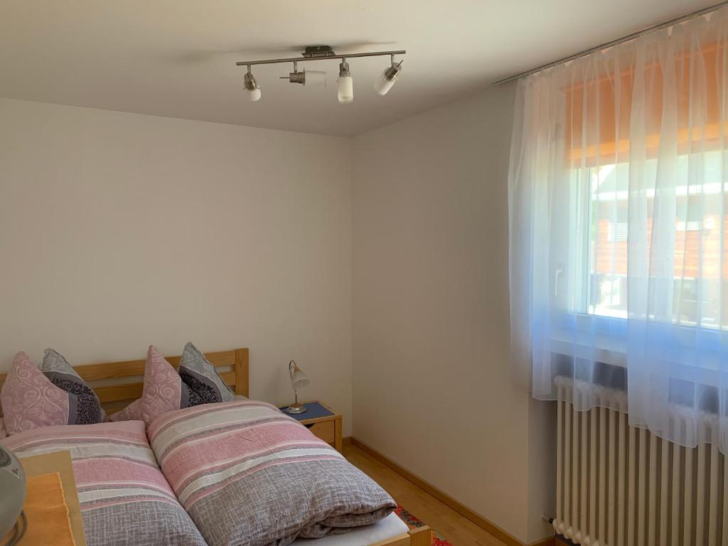 Postel nebo postele na pokoji v ubytování Ferienwohnung Sotcha 8c