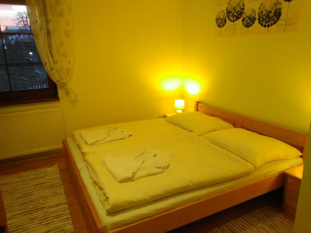 Postel nebo postele na pokoji v ubytování Pod palmou Gerlachov
