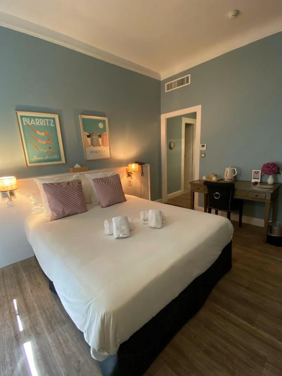 Postel nebo postele na pokoji v ubytování Hotel De L'Océan