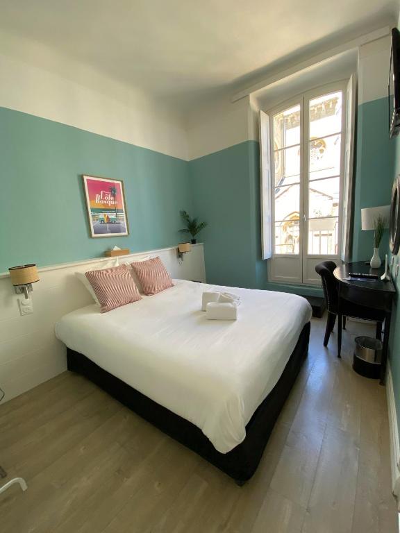 Postel nebo postele na pokoji v ubytování Hotel De L'Océan