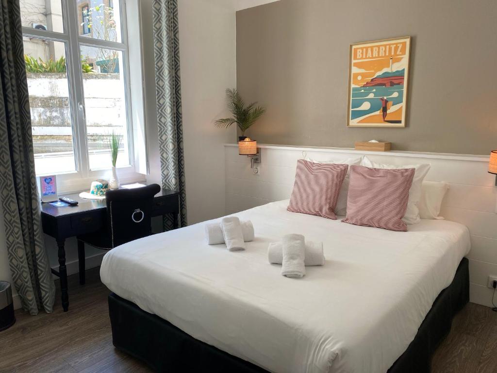 Postel nebo postele na pokoji v ubytování Hotel De L'Océan