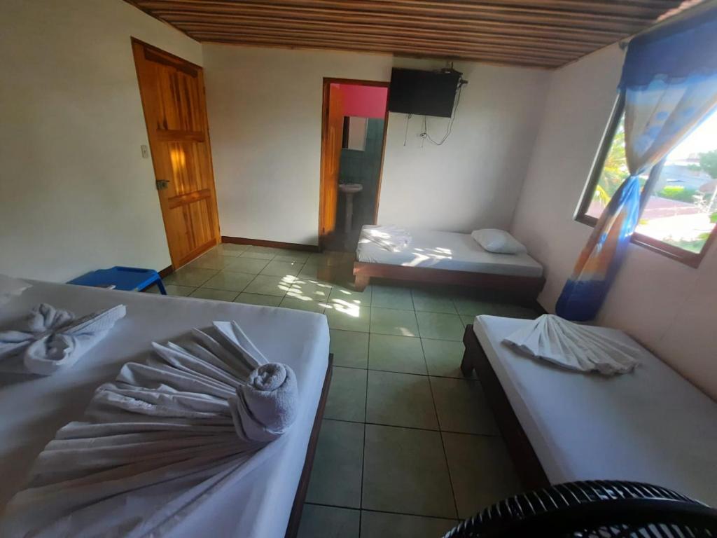 Postel nebo postele na pokoji v ubytování Casa Caribe