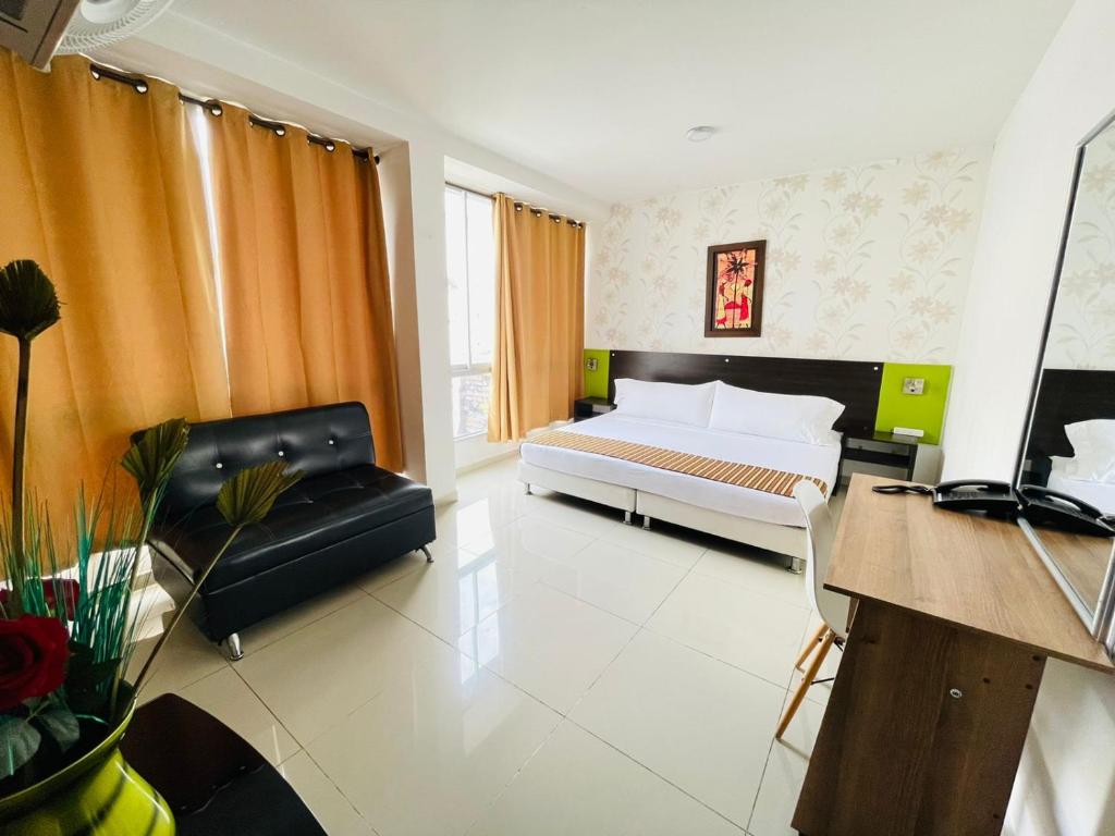 TV a/nebo společenská místnost v ubytování Hotel Suite Center Pereira