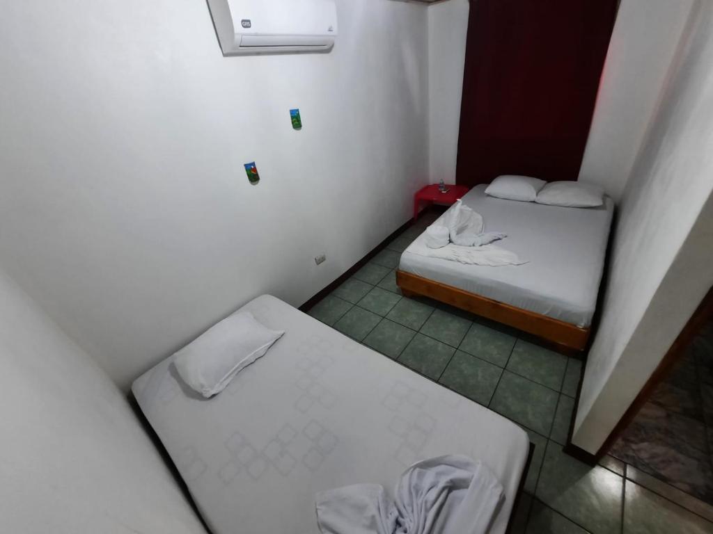 Postel nebo postele na pokoji v ubytování Casa Caribe