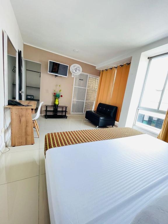 Kuchyň nebo kuchyňský kout v ubytování Hotel Suite Center Pereira