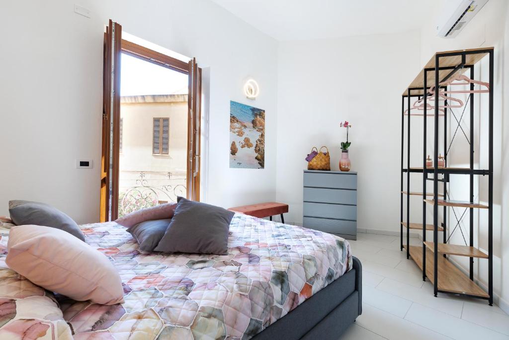 Un pat sau paturi într-o cameră la Antonia Suite