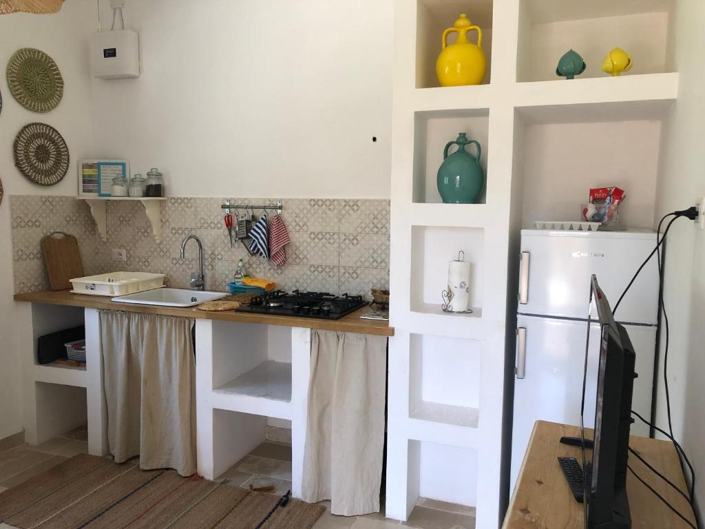 Kuchyň nebo kuchyňský kout v ubytování FICOMORO surf house