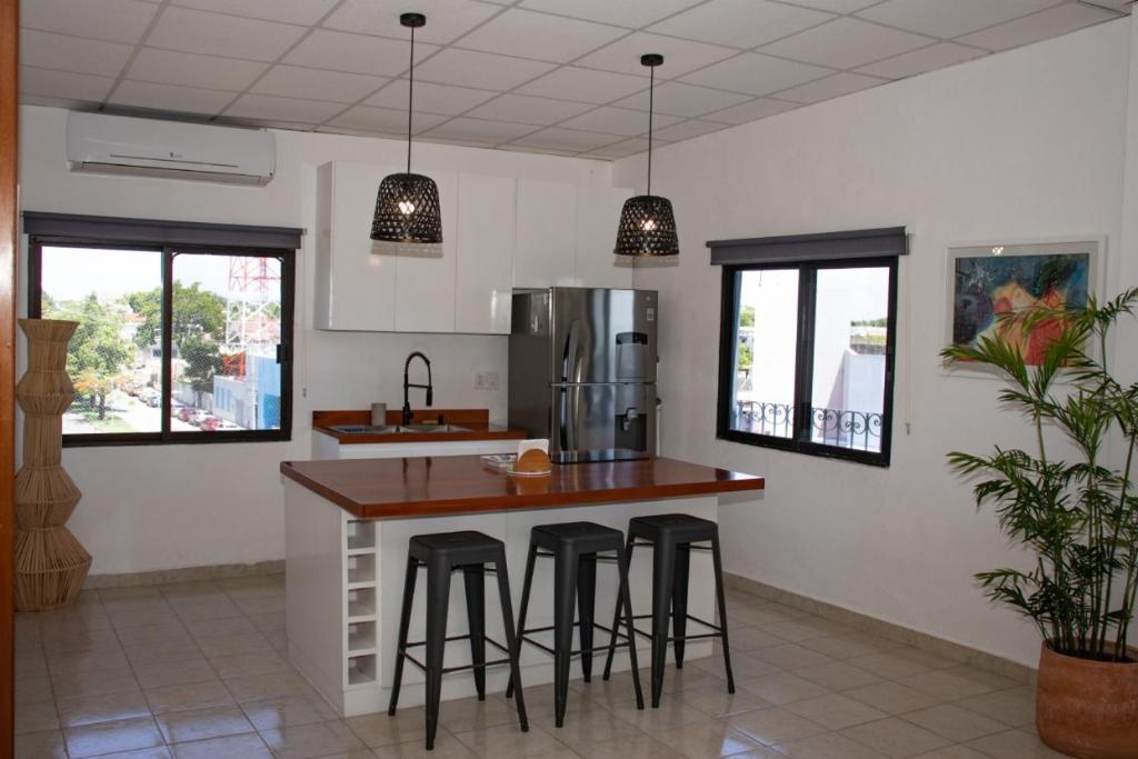 Kuchyň nebo kuchyňský kout v ubytování Hotel & Suites Arges - Centro Chetumal