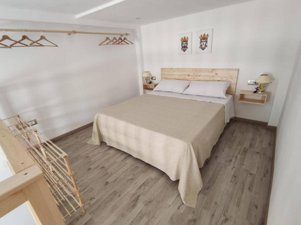 Кровать или кровати в номере La casetta 90 bis