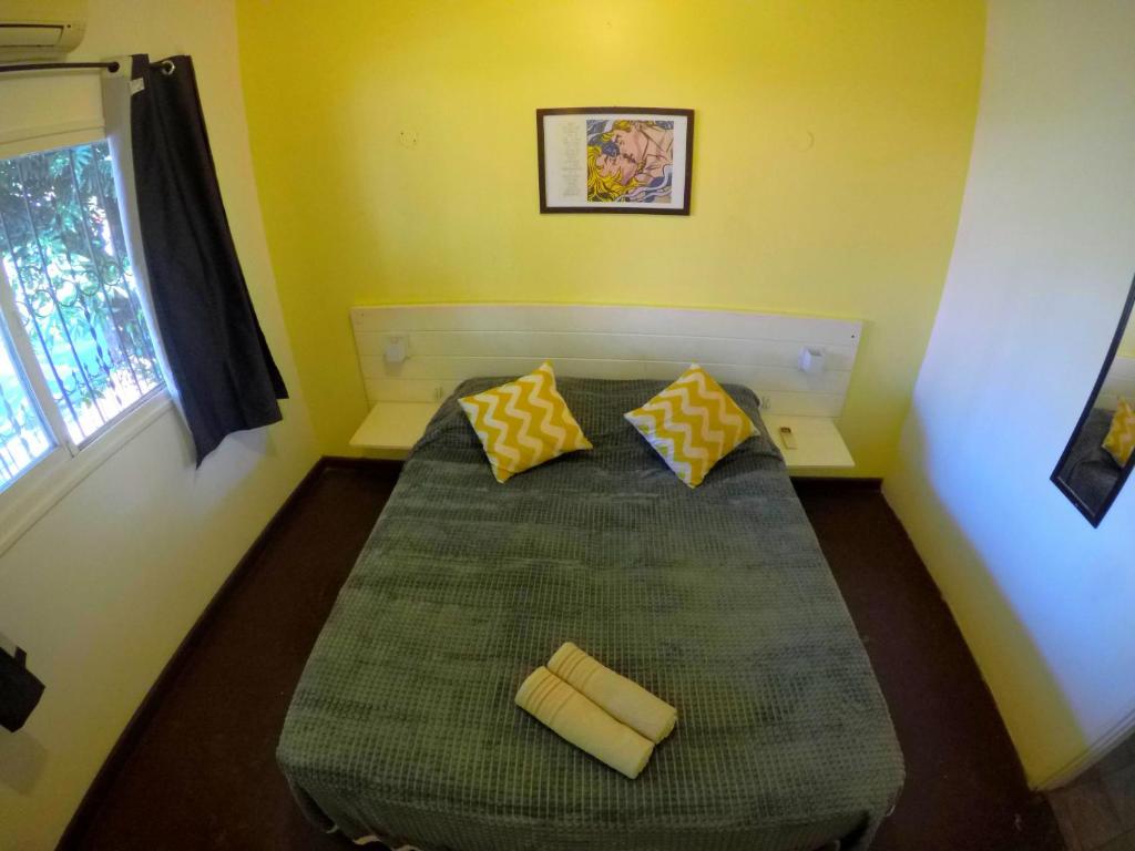Postel nebo postele na pokoji v ubytování Cataratas Jazz Hostel
