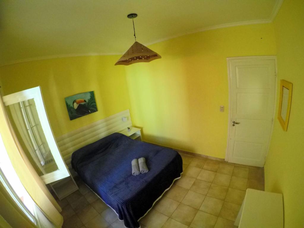Postel nebo postele na pokoji v ubytování Cataratas Jazz Hostel