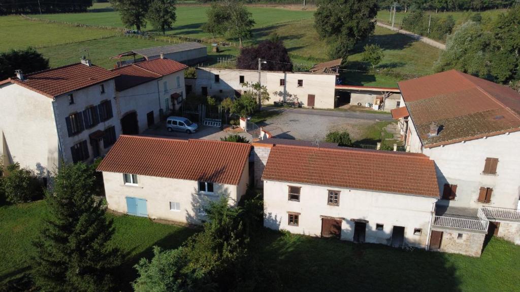 an aerial view of a house in a village at L'Arche d' Engel in Courpière
