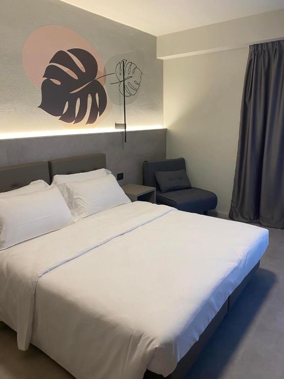 Postel nebo postele na pokoji v ubytování Hotel Lily