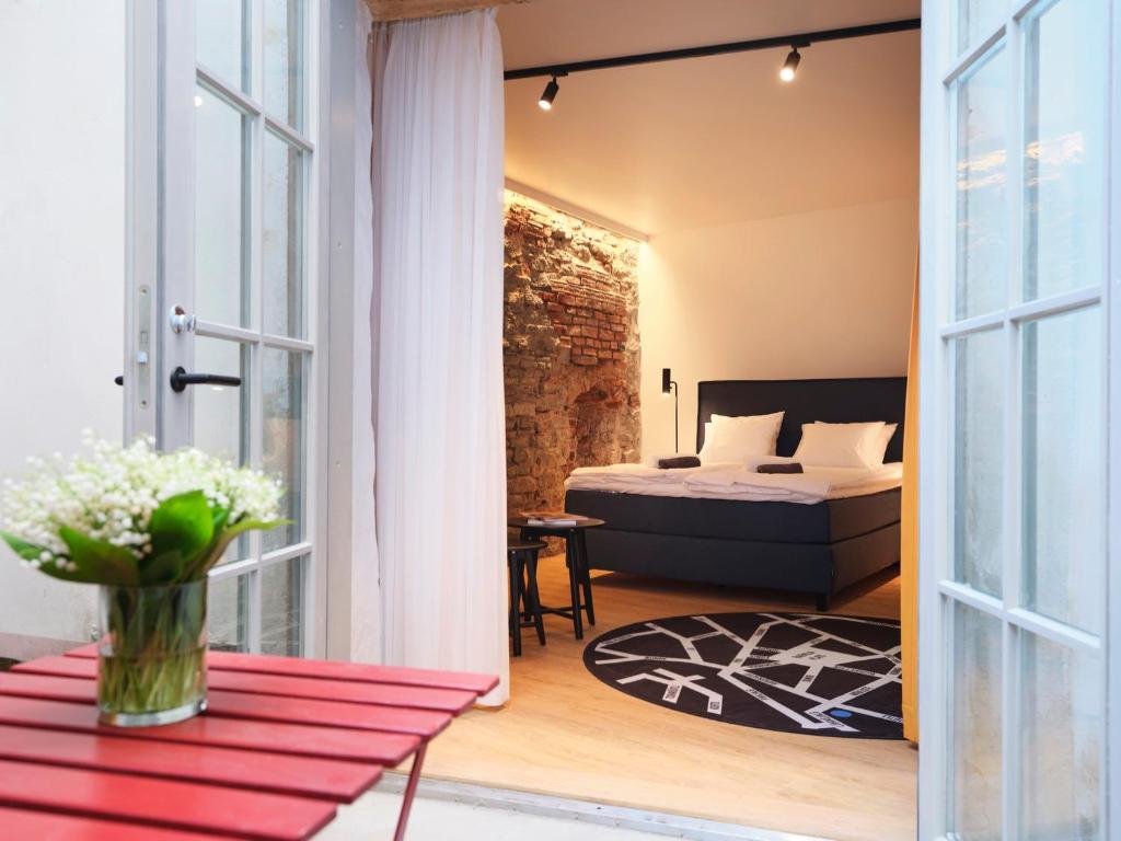 En eller flere senger på et rom på LJ5 - Old Town Rooms with Exclusive shared Roof Terrace