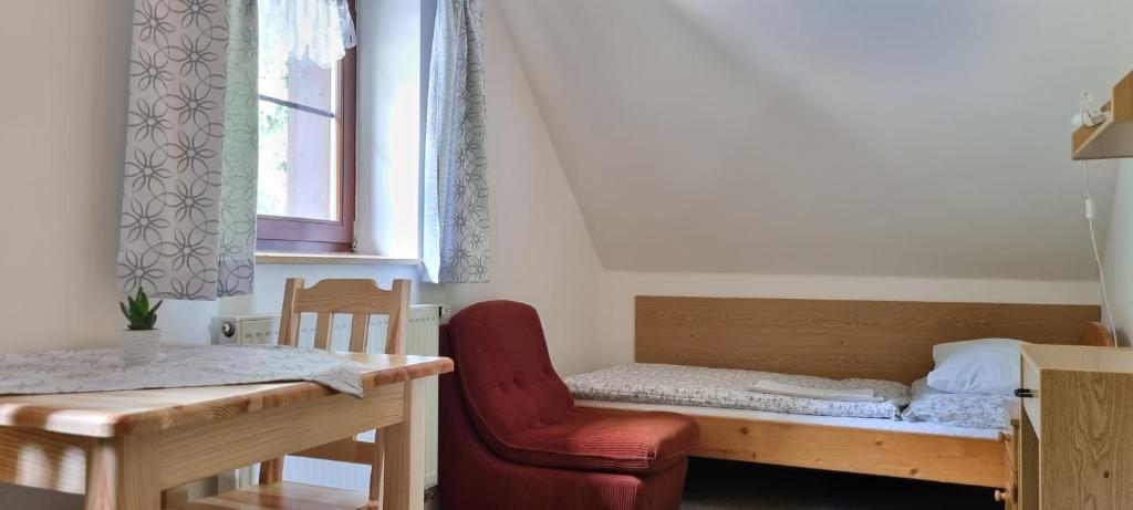 Postel nebo postele na pokoji v ubytování Pension Helena Honesová