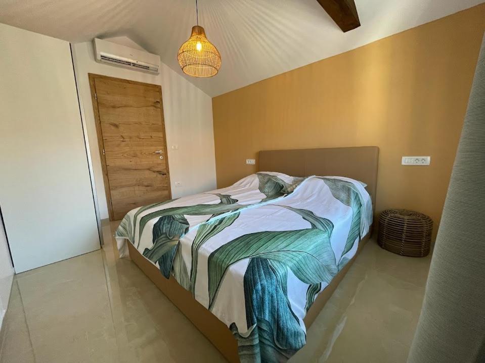 Postel nebo postele na pokoji v ubytování Eco Sea Residence