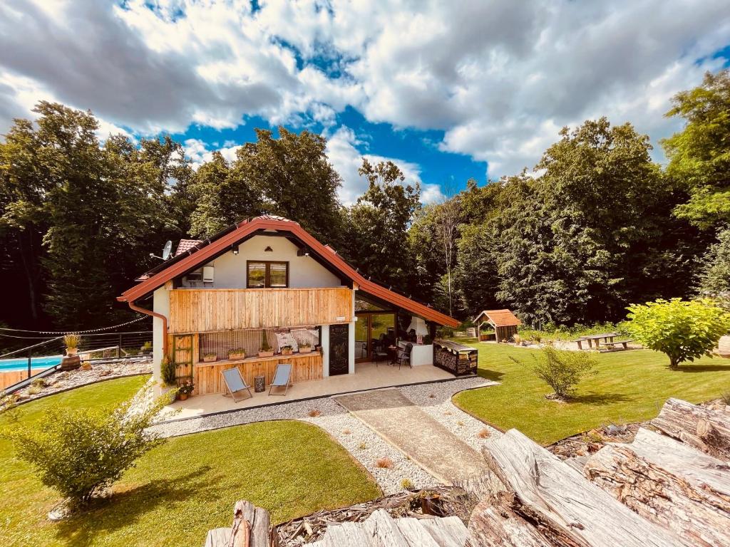 a home with a large yard with a house at Wellness Holiday House Lagev in Moravske Toplice