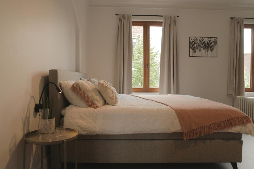 Postel nebo postele na pokoji v ubytování MAISON KITOKO