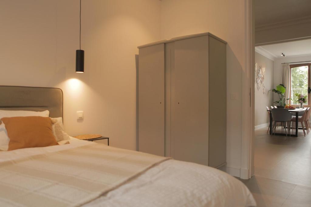 Postel nebo postele na pokoji v ubytování MAISON KITOKO