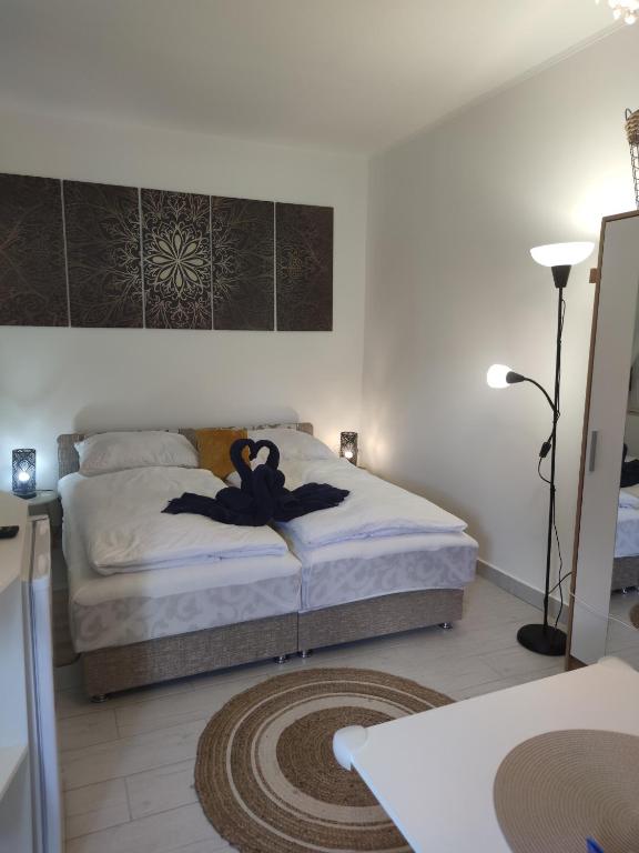 A bed or beds in a room at Wagner Apartman Tata