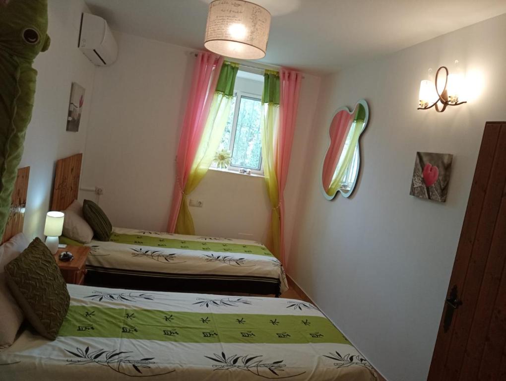 Łóżko lub łóżka w pokoju w obiekcie Home Benitez Pizarra