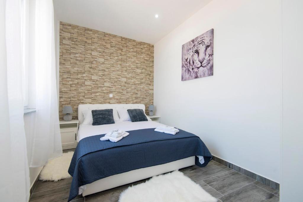 Posteľ alebo postele v izbe v ubytovaní Pleasure Sea View Apartment Zadar