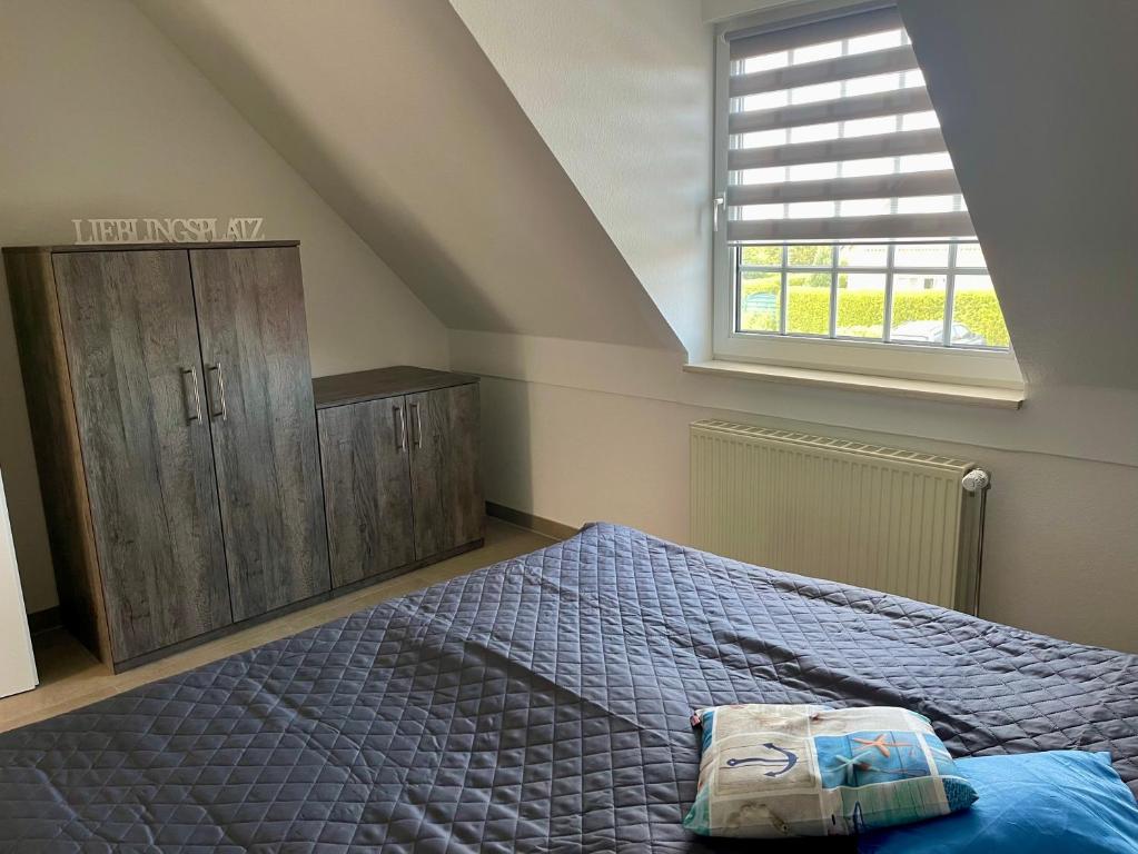 Postel nebo postele na pokoji v ubytování Ferienwohnung Lieblingsplatz-Greetsiel